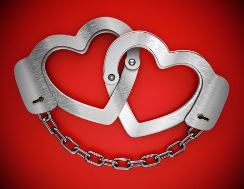 Heart,Shaped,Handcuffs,Attached,To,Each,Other.,3d,Illustration
